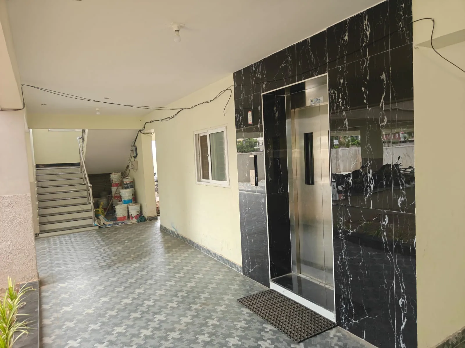 Lift lobby clad in black marble at Velagapudi Brundavanam